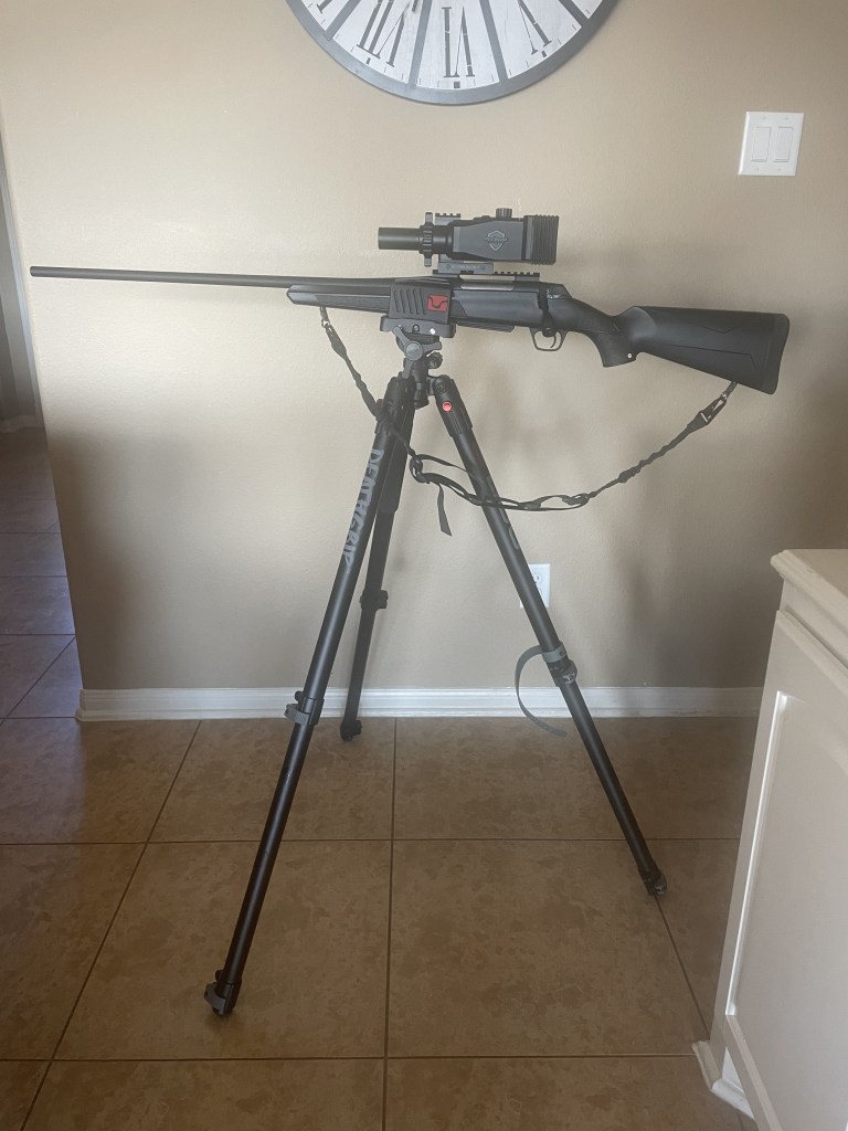 A picture of The rifle Mike uses is mounted on a shooting tripod.